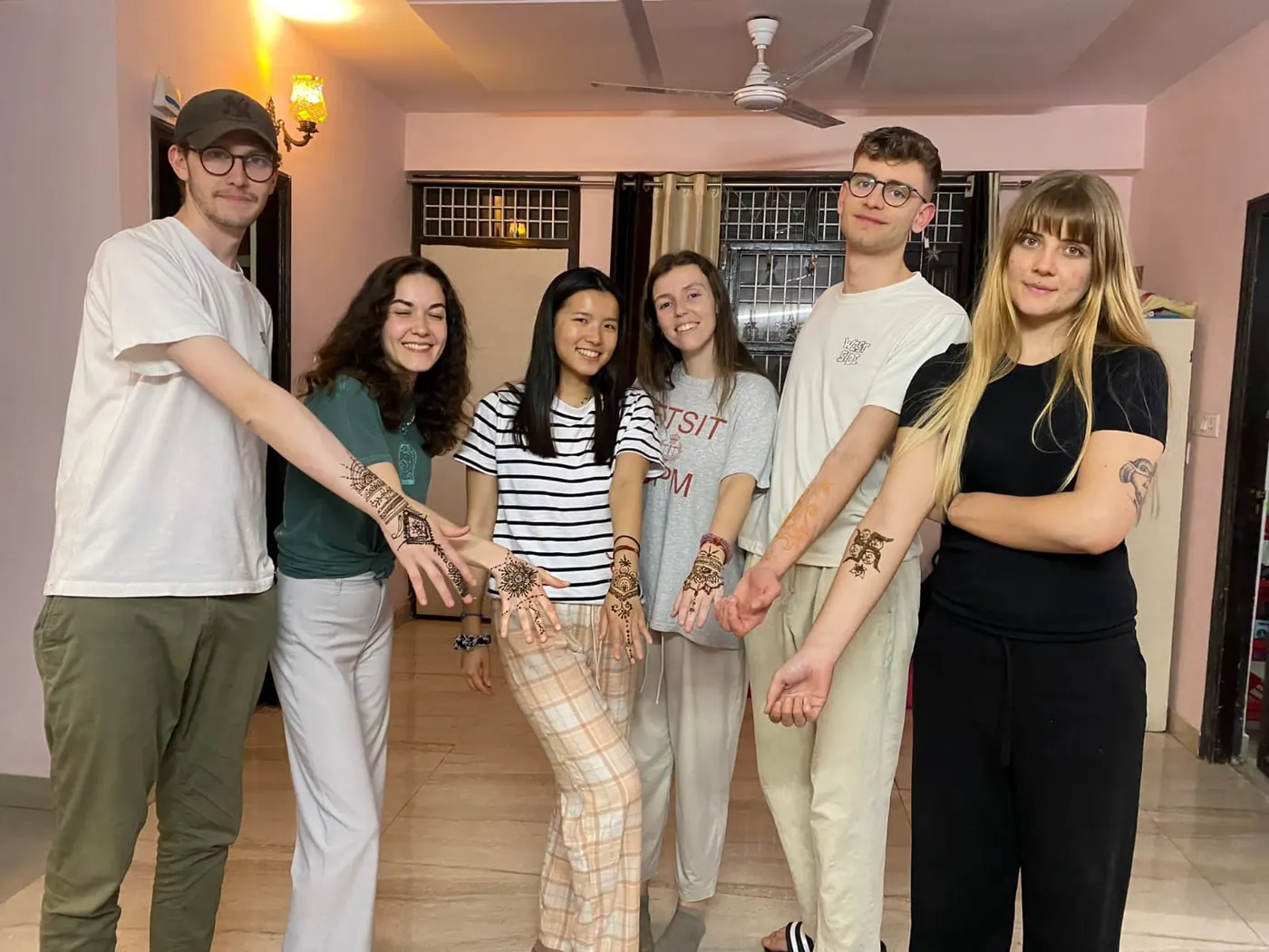 Group of young volunteers with henna, a cultural experience in India