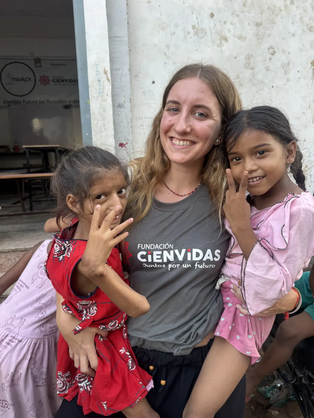 Young volunteer with girls at the free school in Jaipur, India