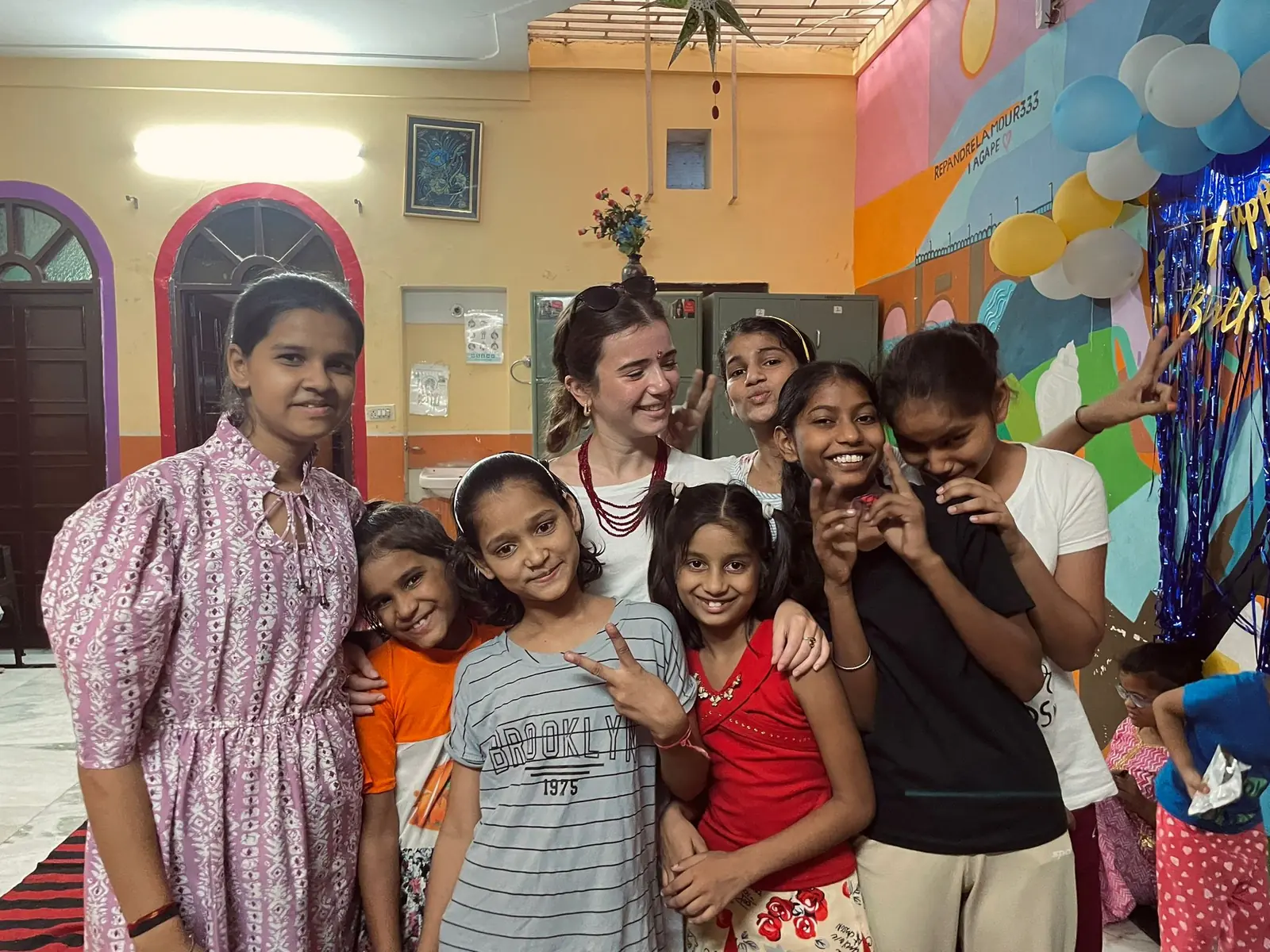 Volunteers celebrating a birthday with girls in India