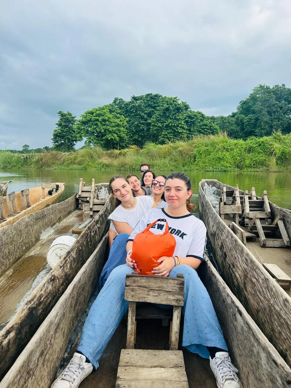 Young volunteers canoeing on the Chitwan river, Nepal