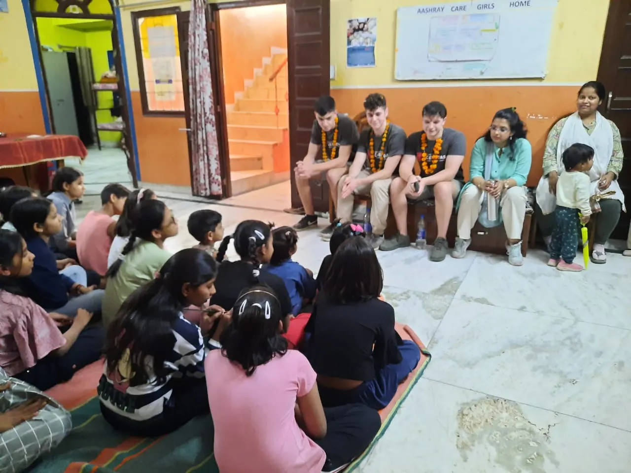 Young volunteers taking part in a group activity at the children's home